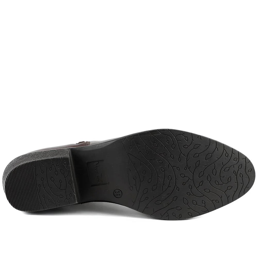 Women's ankle boot rubber outsole with textured tread pattern