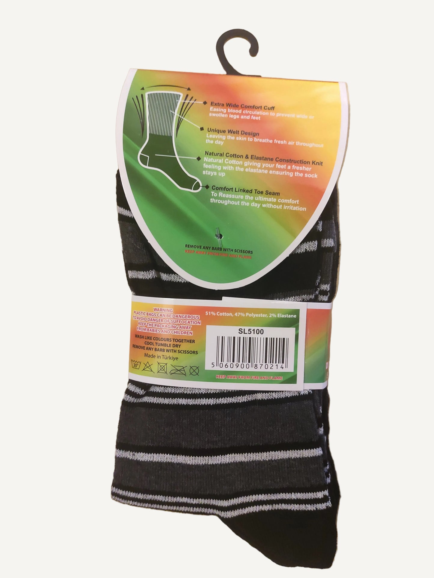 Black and white striped socks with colorful packaging on a wooden surface