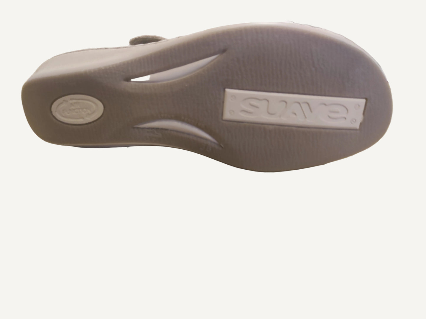 Gray sandal with 'Skechers' branding on a wooden surface