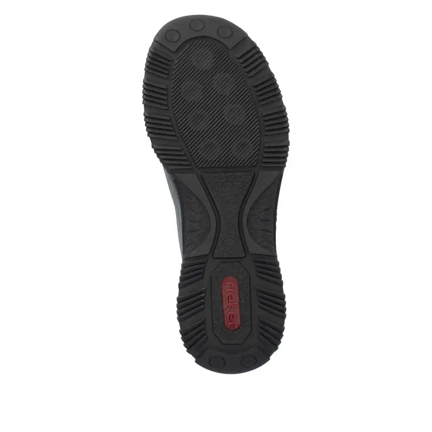 Women's shoe outsole with grippy tread and visible logo on black rubber sole