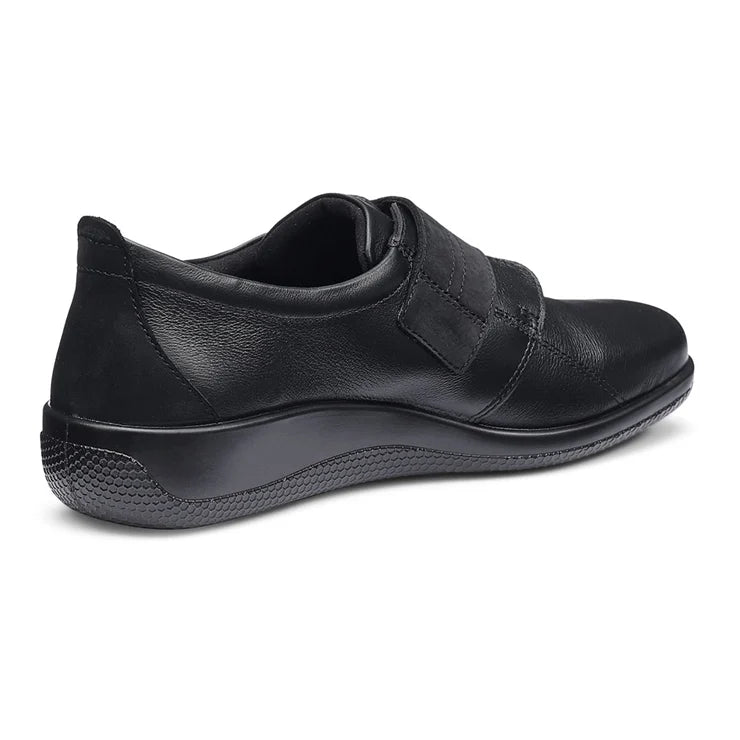 Black leather women's wide-fit shoe with strap fastening and textured comfort sole