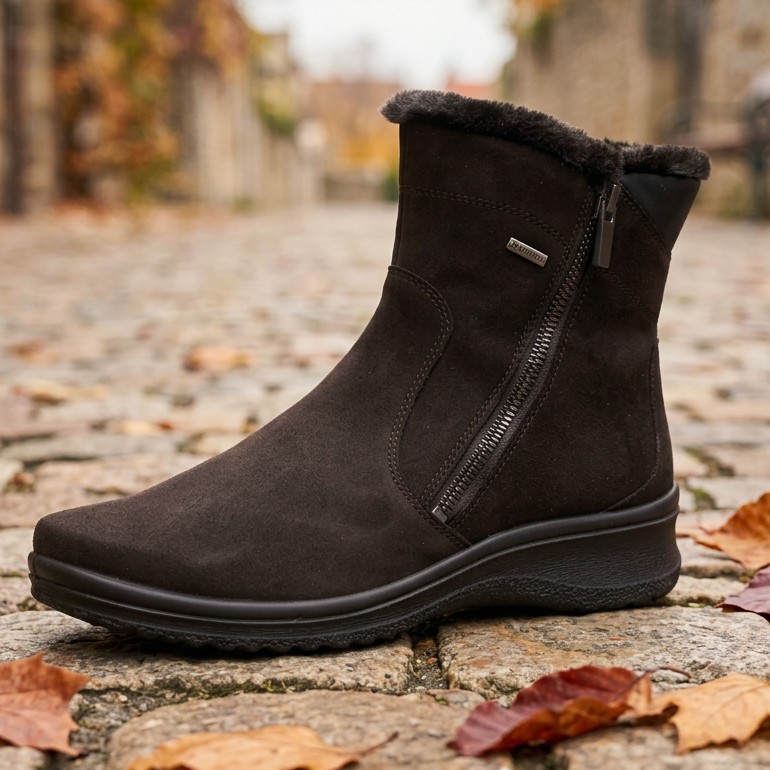 Ara black ankle boot with faux-fur cuff, side zipper, and textured sole