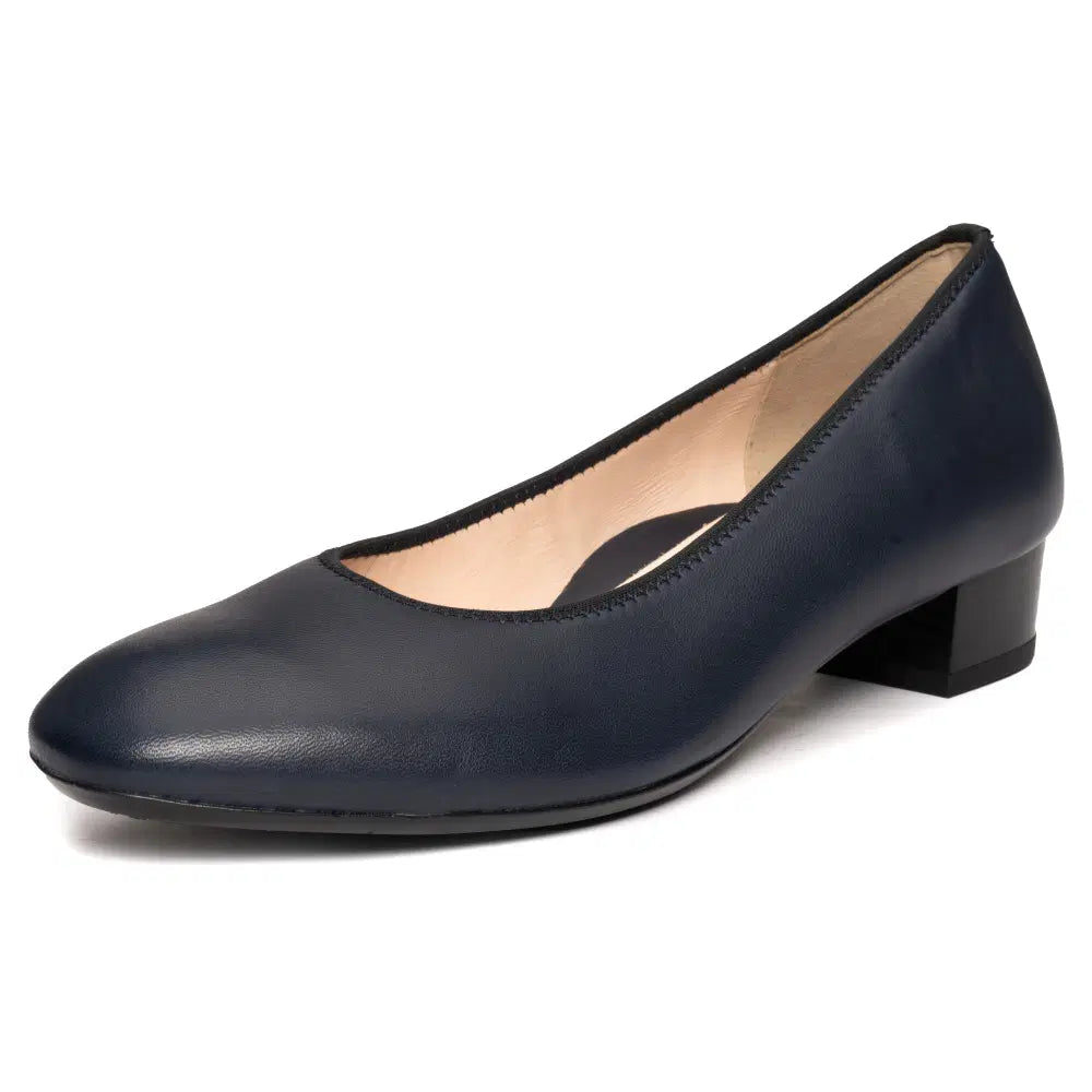 Dark blue leather court shoe with rounded toe and low block heel, three-quarter view