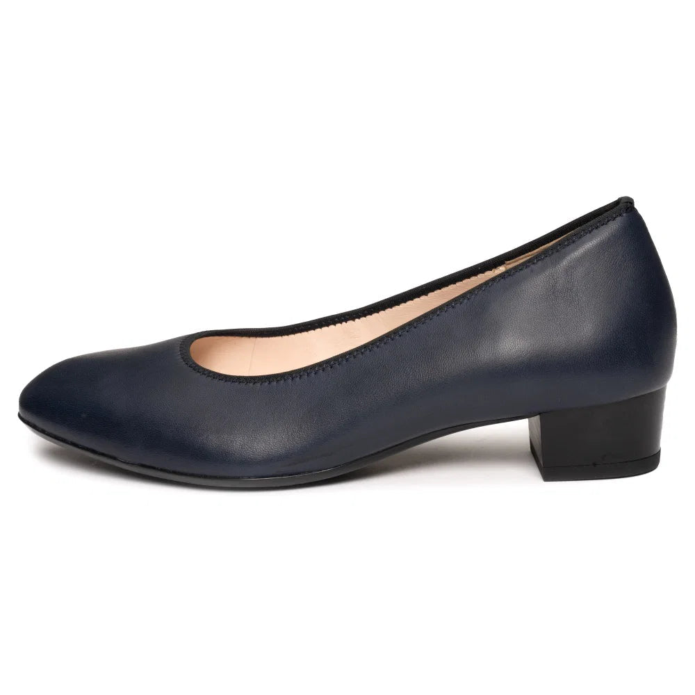 Dark blue leather court shoe in side profile with low block heel