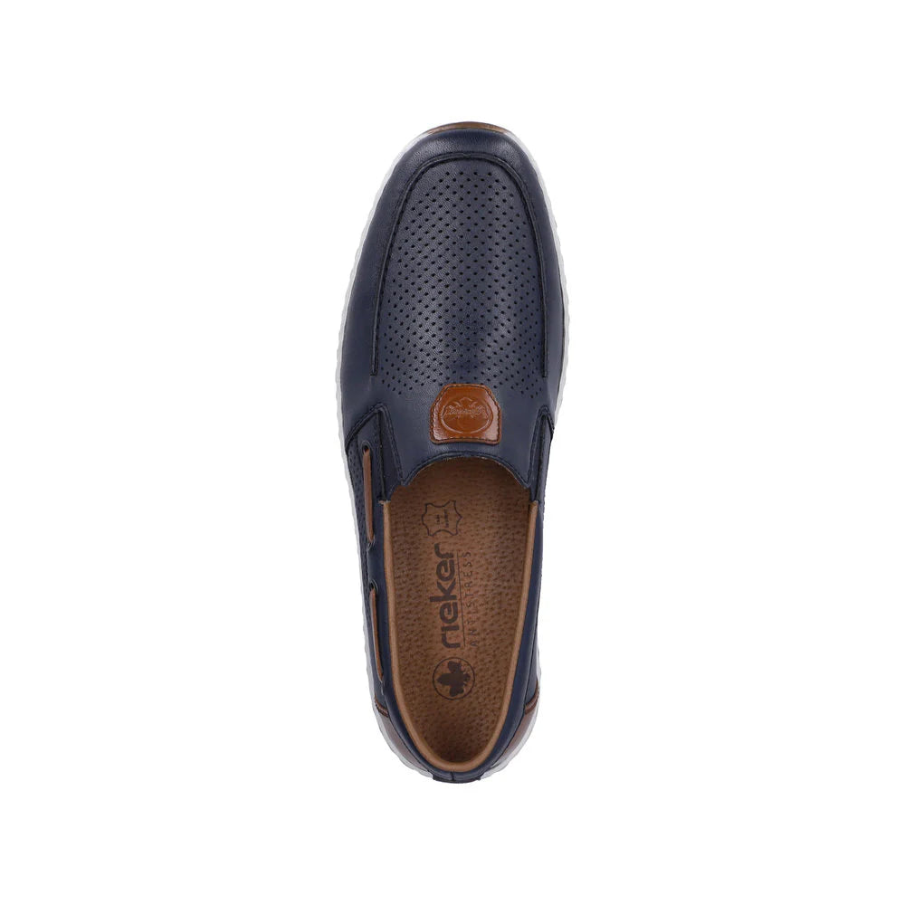 Navy slip-on shoe with brown sole on a white background