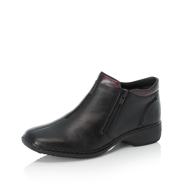Women’s black leather ankle boot with side zipper and low wedge sole