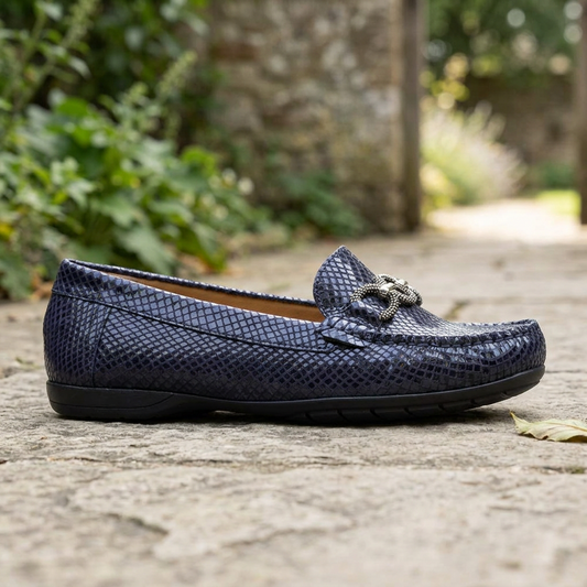 Women's navy textured loafer with bow strap and metal buckle detail