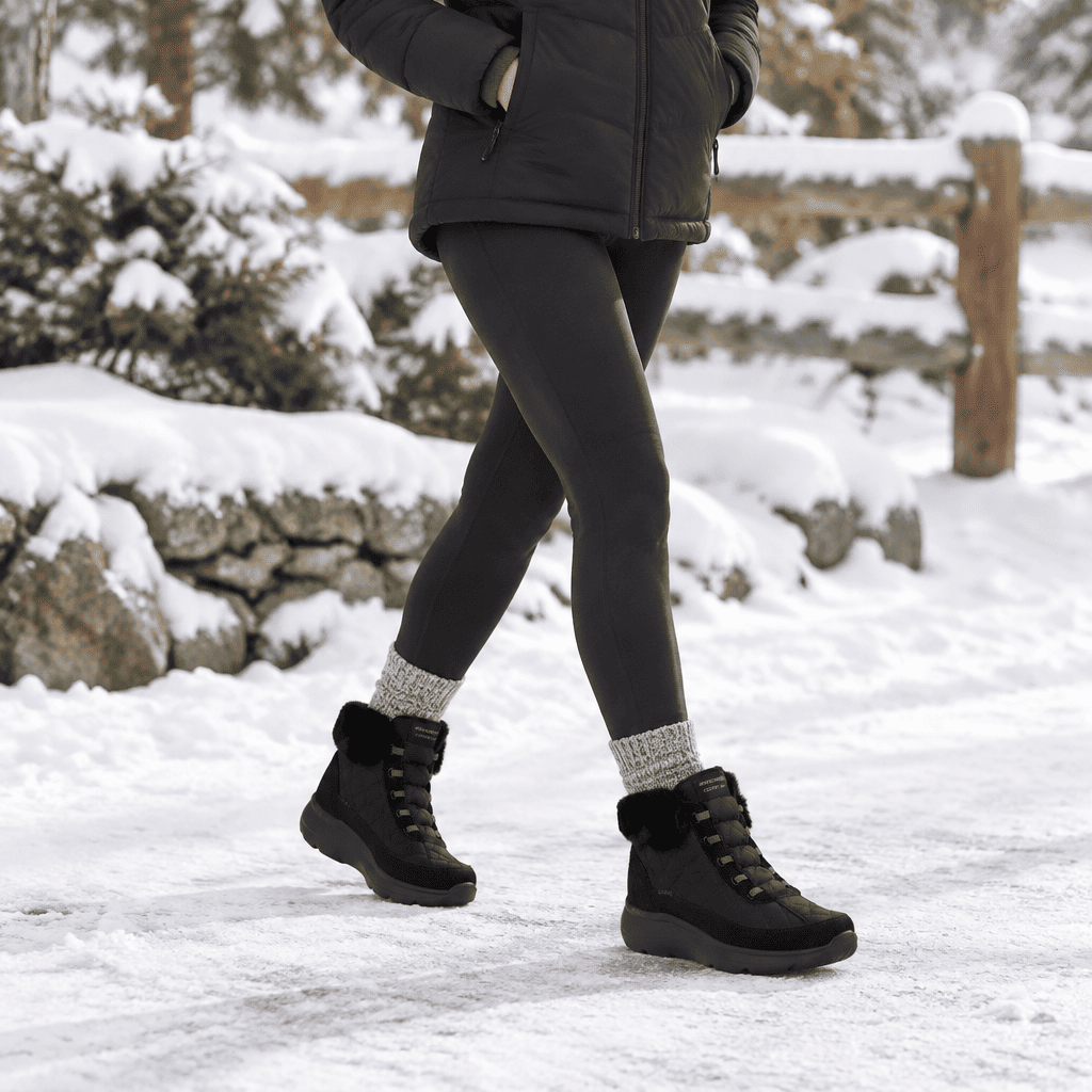 Women's black ankle boot with lace-up design and cushioned platform sole