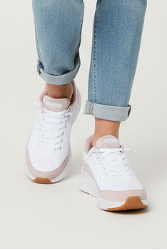 White and pink sneaker with visible brand name on a white background