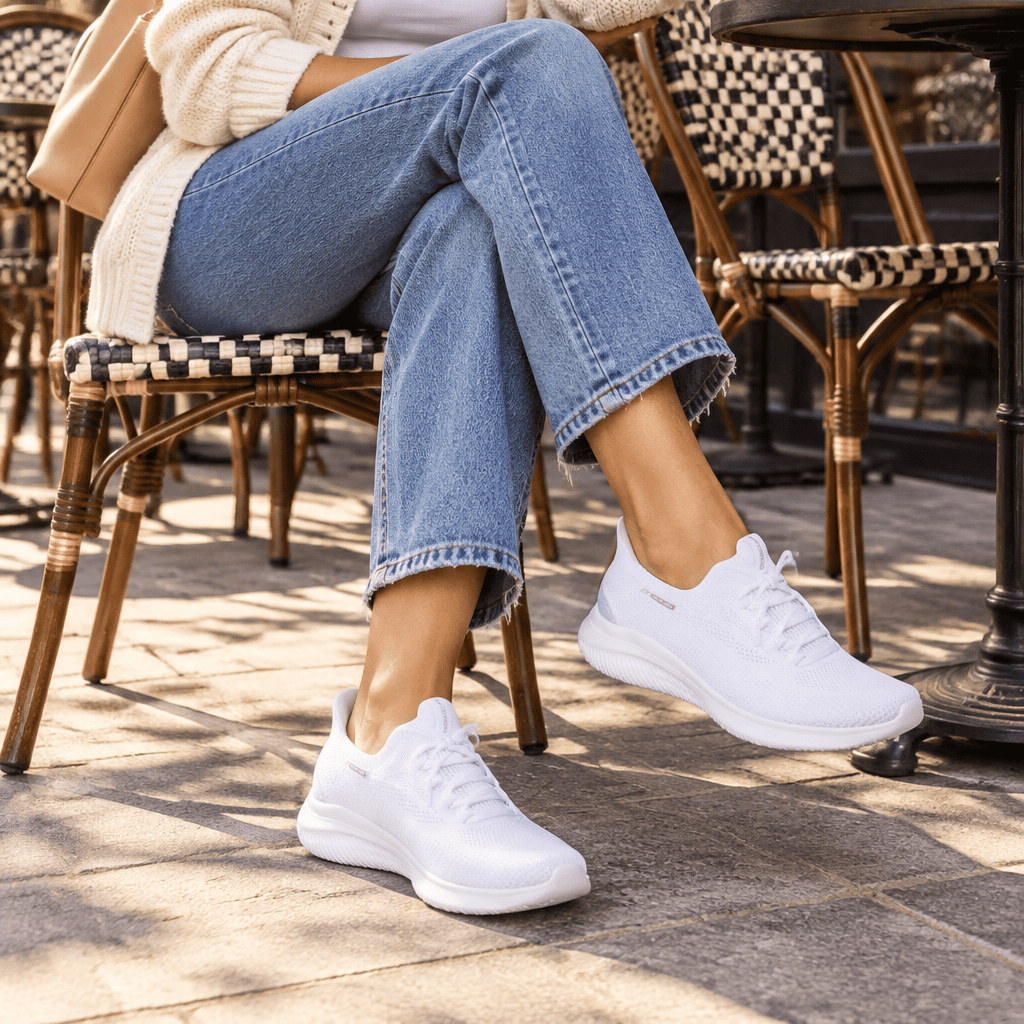 Women's white slip-on knit trainer shoes, cushioned sole, low profile