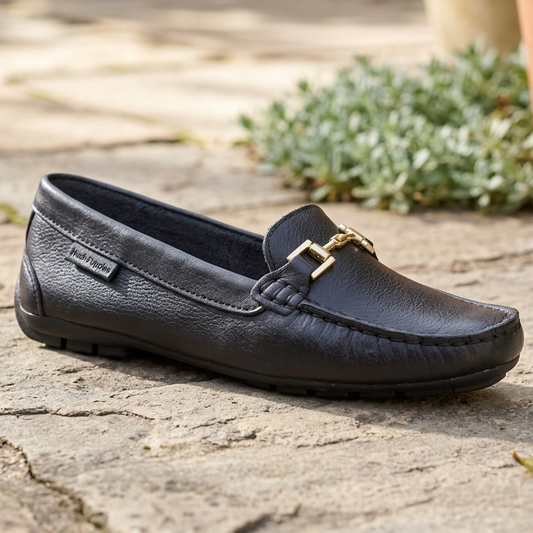 Black leather women's loafer with gold buckle strap and cushioned lining