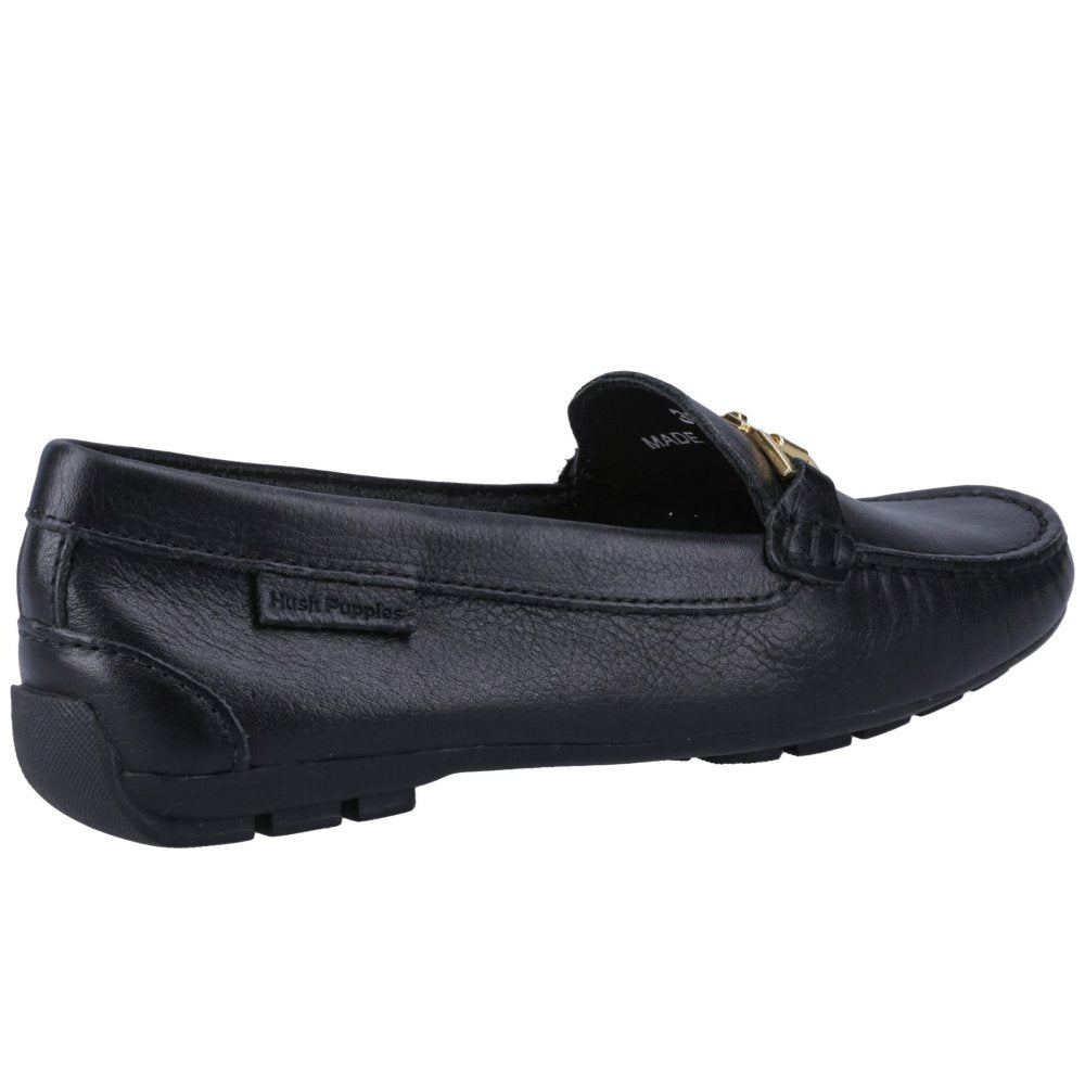 Black leather women's loafer side view with gold metal bit buckle and tassel knot