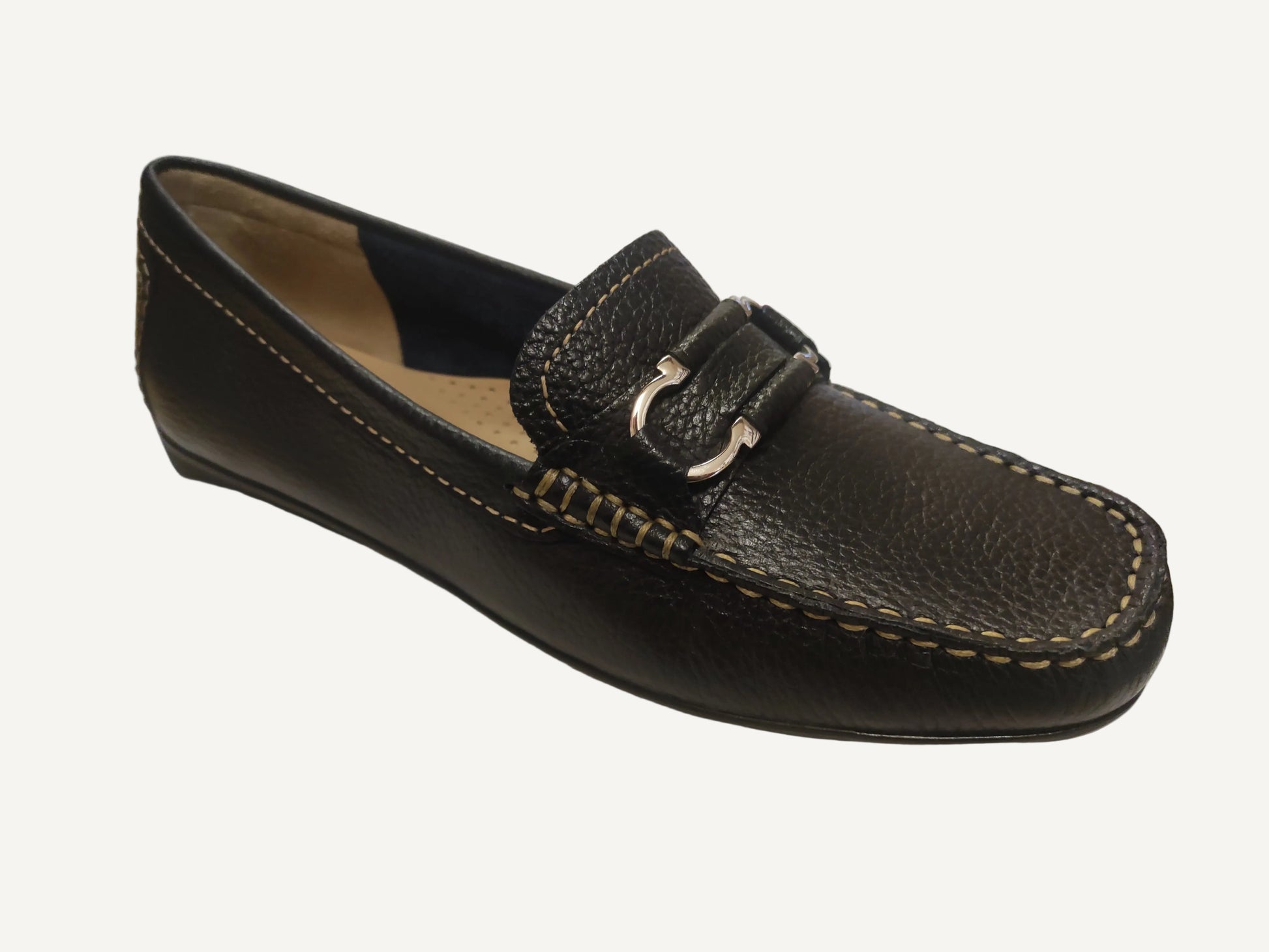 Black leather loafer with a buckle on a white surface