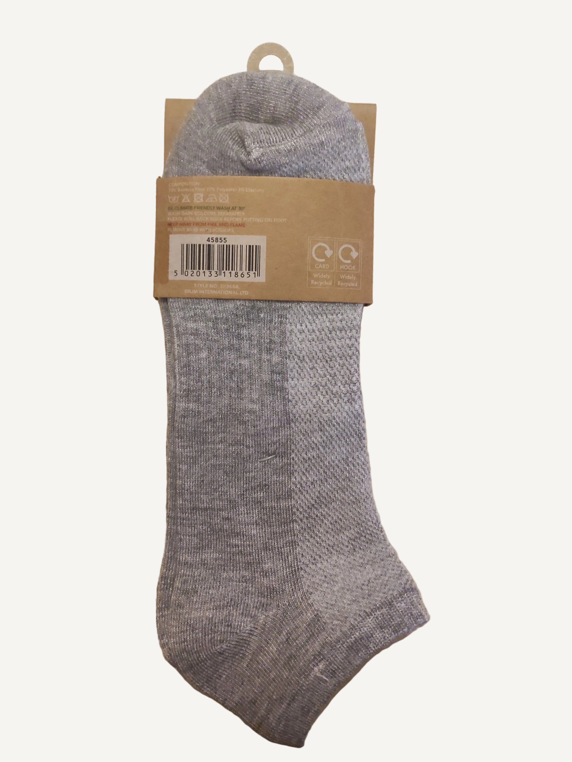 Gray sock with cardboard packaging on a wooden surface