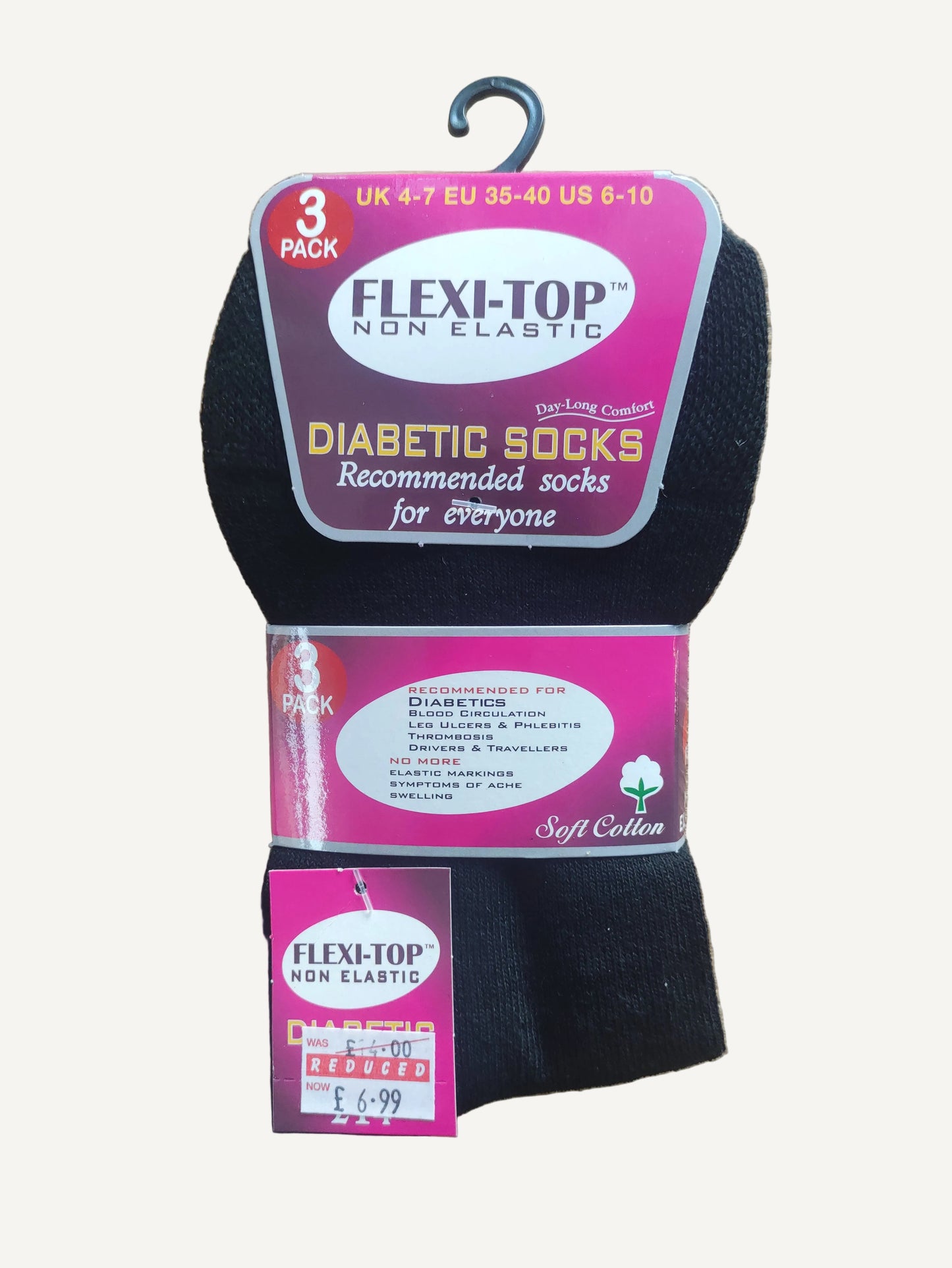 Pack of diabetic socks with packaging on a wooden surface
