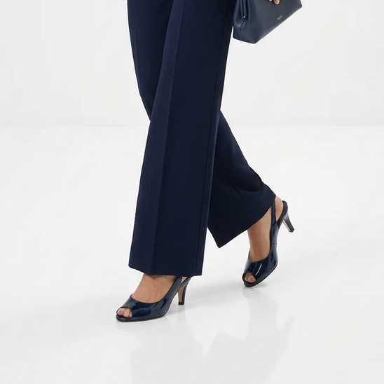 Navy patent open-toe slingback sandal with mid heel and ankle sling strap