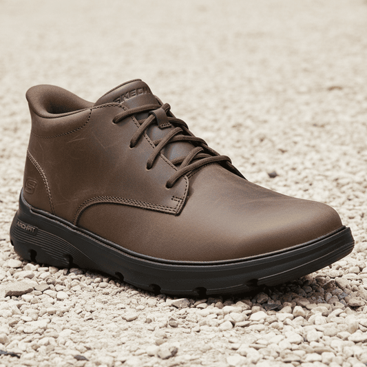 Men's lace-up chukka boot in dark cocoa-brown on gravel with thick rubber sole