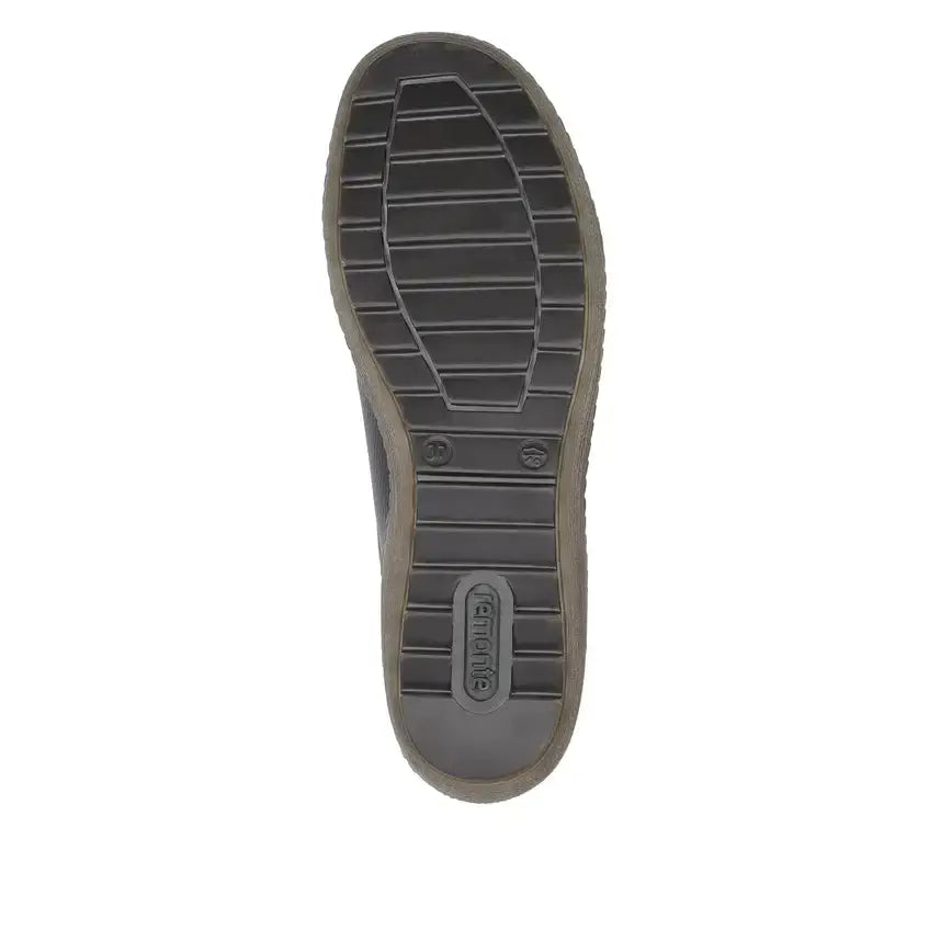 Navy shoe outsole with deep tread and rubber sole, brand marks visible