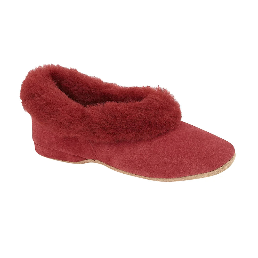 Women’s sheepskin slippers in cherry red with fuzzy slip-on design and suede sole edge