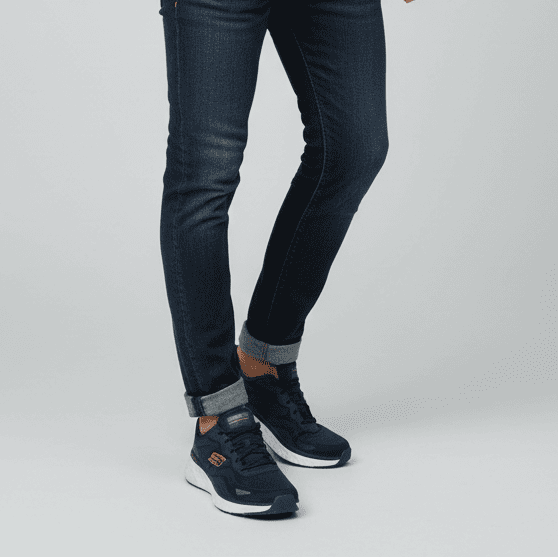 Men's navy waterproof lace-up trainer worn with jeans, low-profile sporty sole