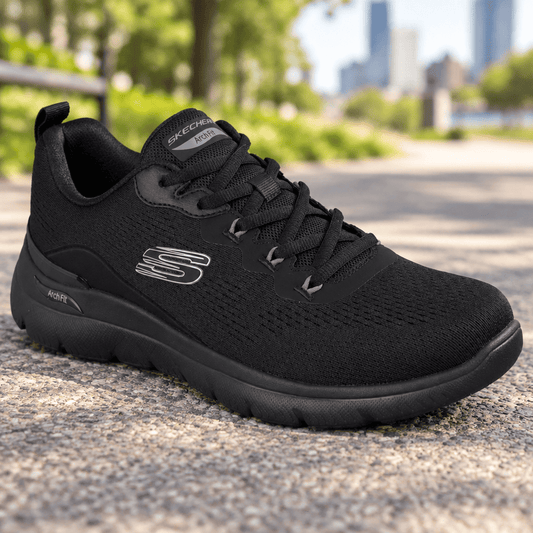 Men's black lace-up trainer sneakers on pavement with cushioned midsole