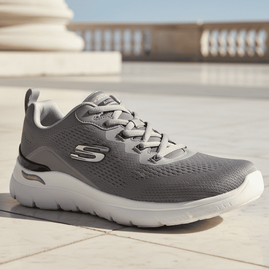 Men's Skechers charcoal knit trainers with white midsole and gray laces, side S logo