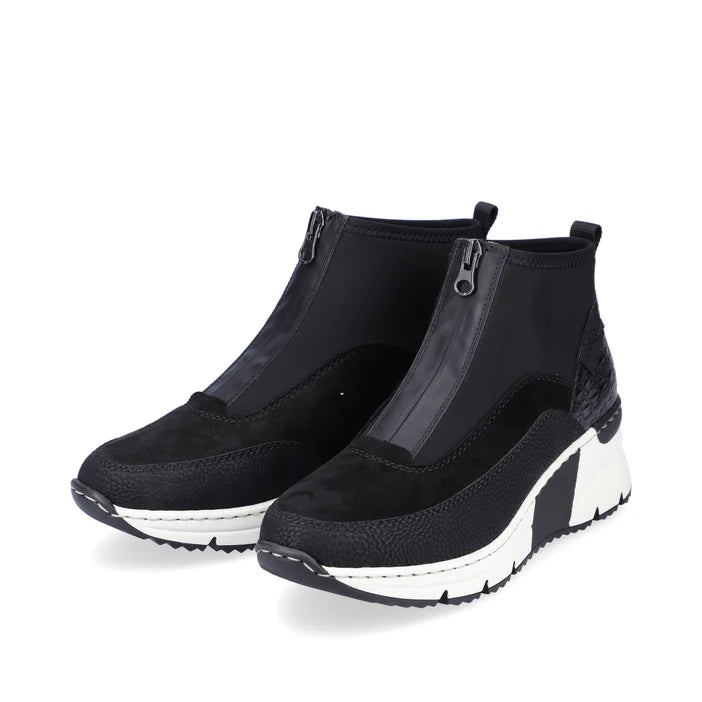 Women's black zip boot with side zipper and chunky white sole