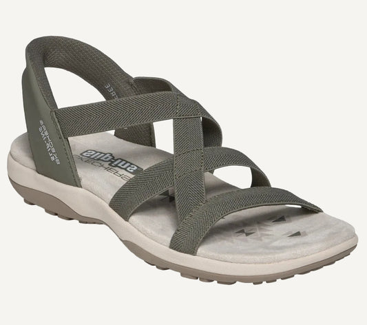 Gray sandal with crisscross straps on a white background
