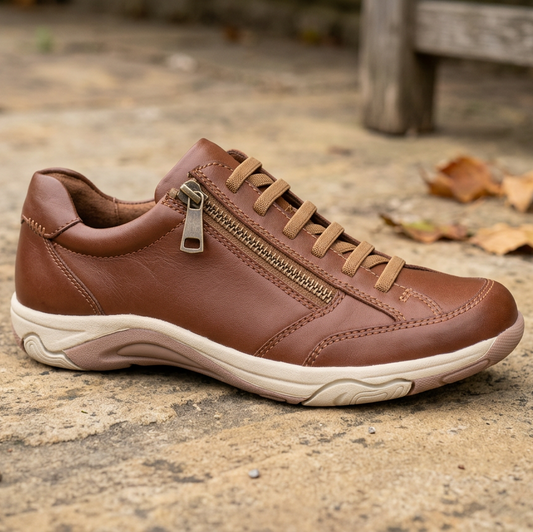 Brown leather sneakers with side zipper, lace-up eyelets, and cushioned white sole