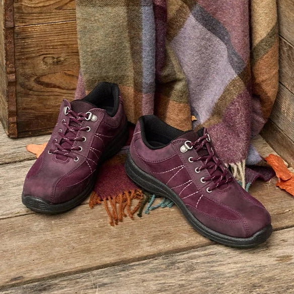 Two women's dark cherry lace-up walking shoes with black lining and tread sole