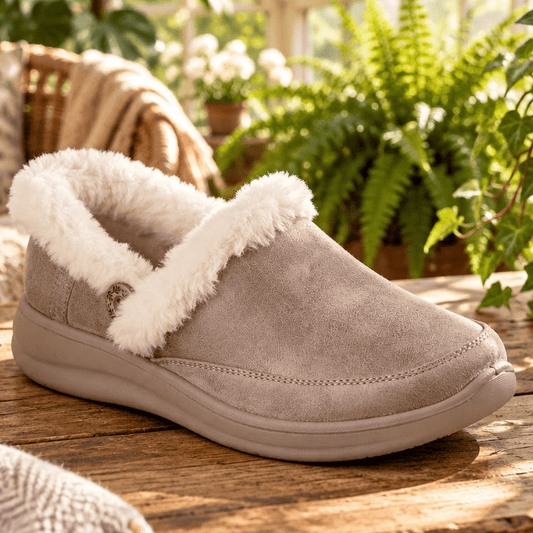 Women's taupe slip-on slipper with plush fur trim and cushioned sole