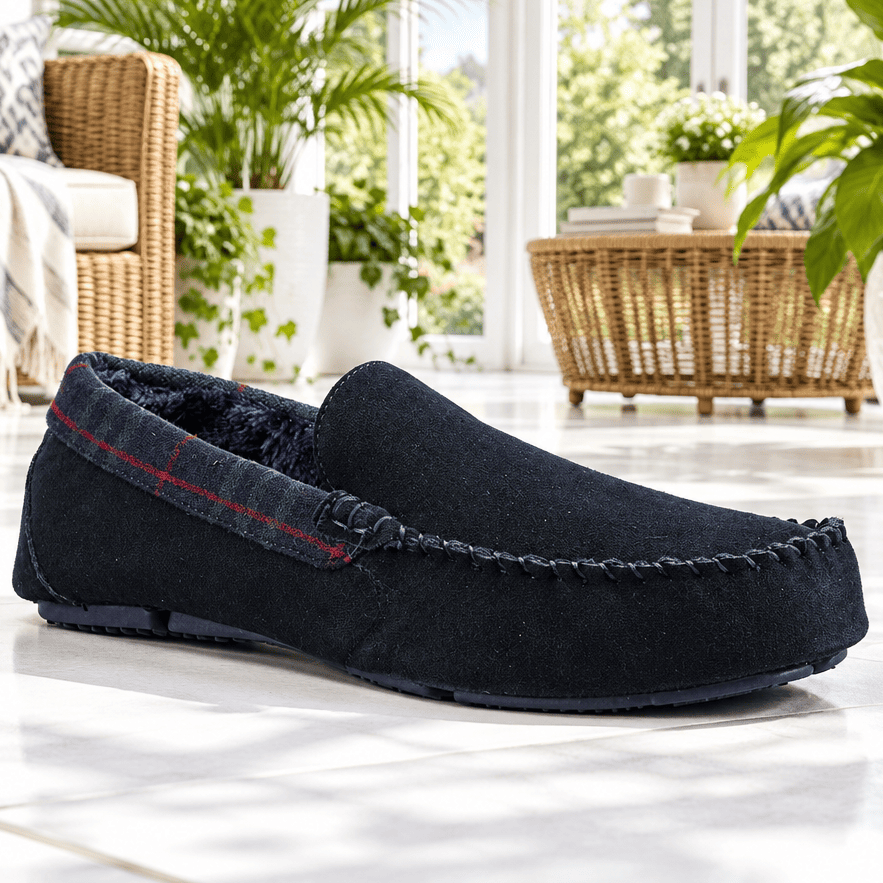 Navy suede moccasin slippers with tartan strap and dark moc-toe stitching