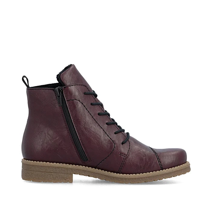 Women's lace-up ankle boot in burgundy leather with side zipper and rubber sole.