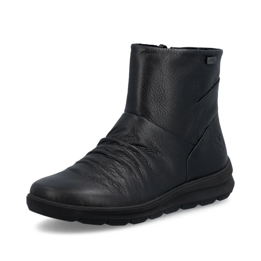 Women's black leather ankle boot with side zipper and cushioned tread sole