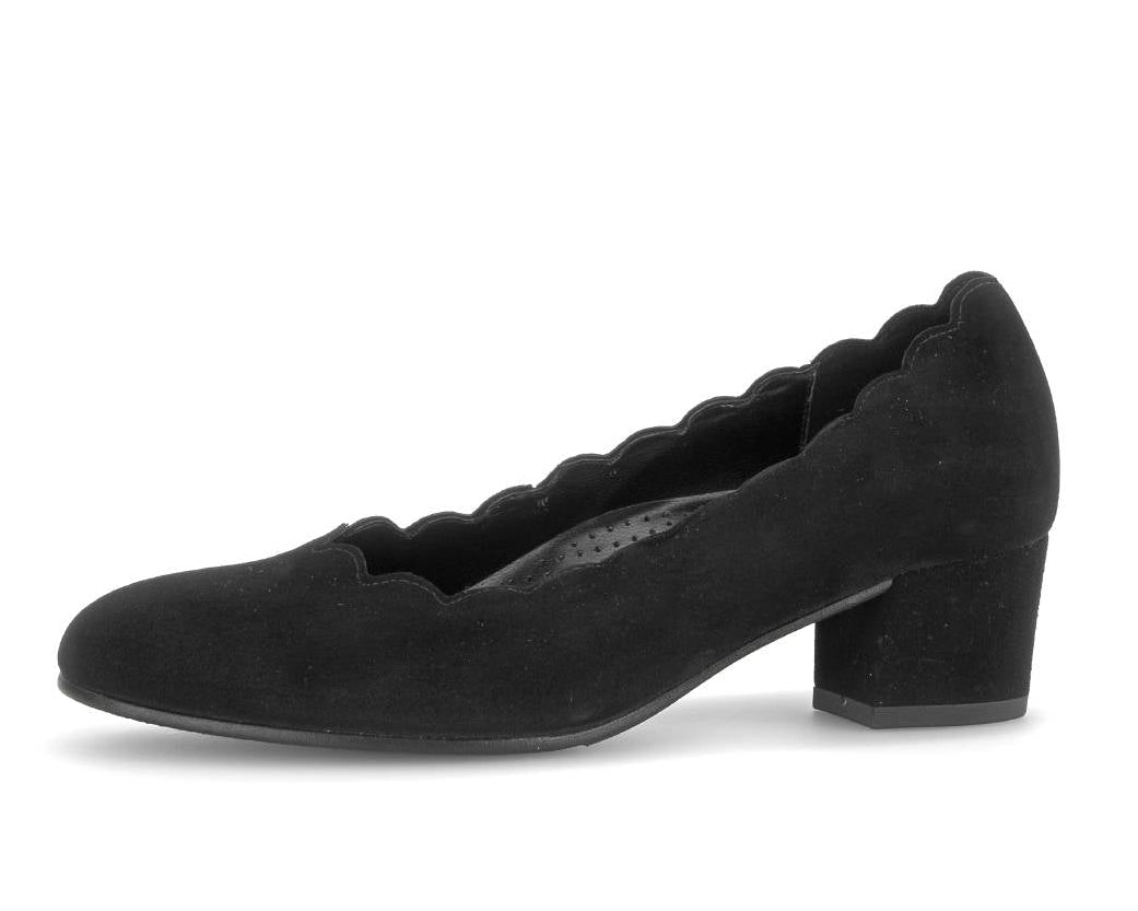 A single black suede pump shoe with a scalloped edge and a low block heel, shown from a side profile on a white background.
