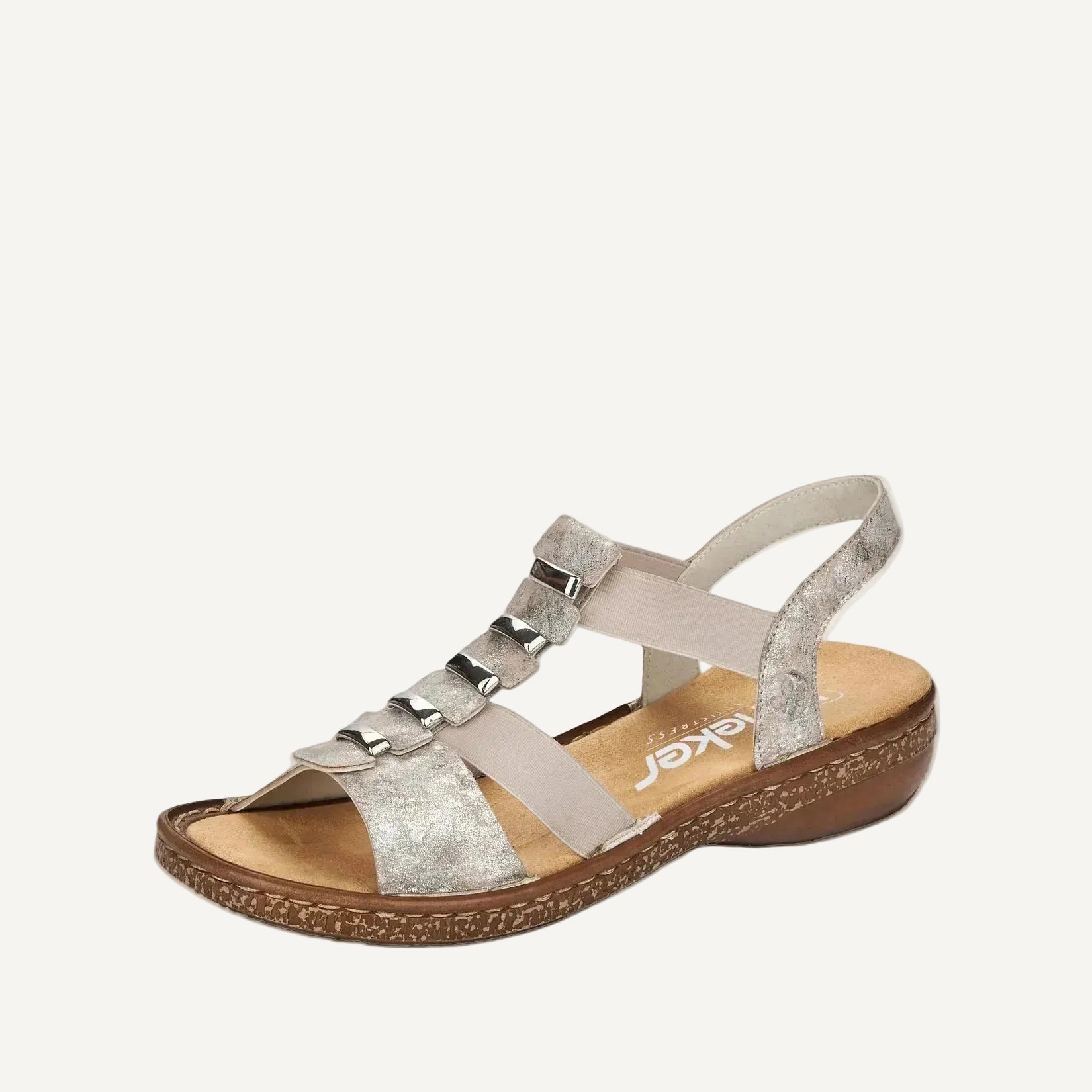 Beige sandal with metallic straps on a white background
