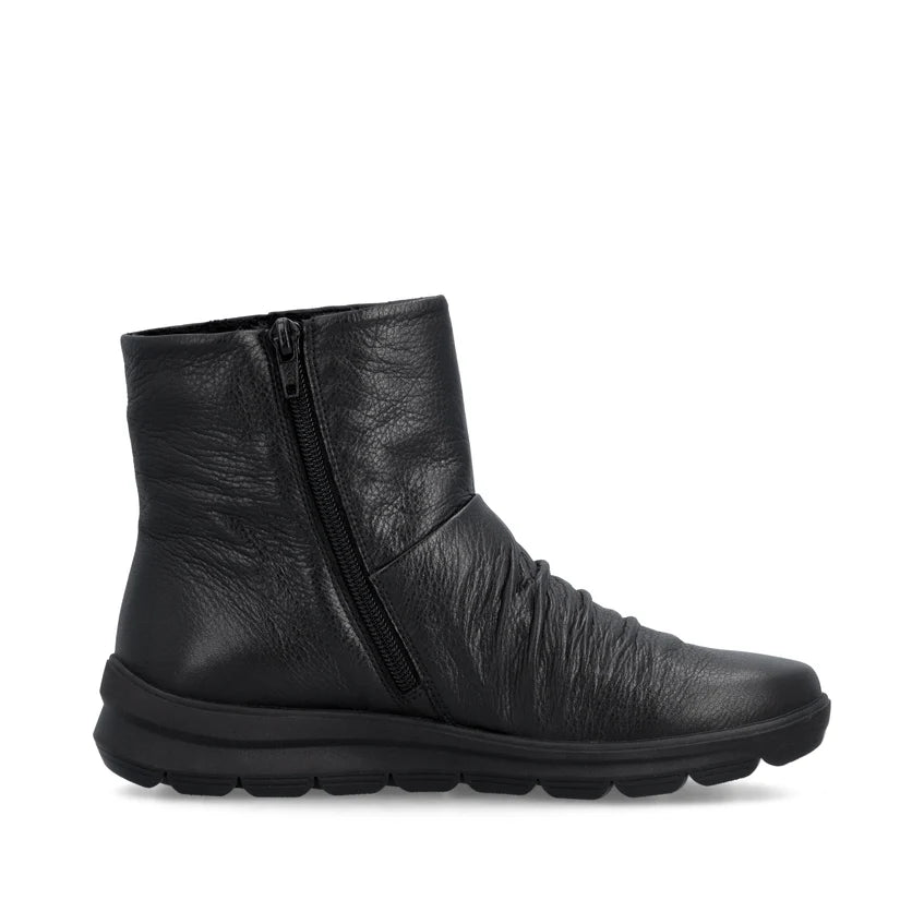 Women's black leather ankle boot with side zipper and tread sole