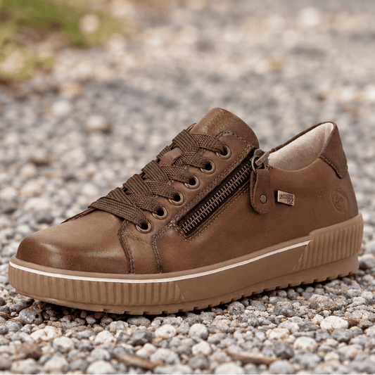 Brown leather lace-up sneaker with side zipper, cushioned collar, and tread sole.