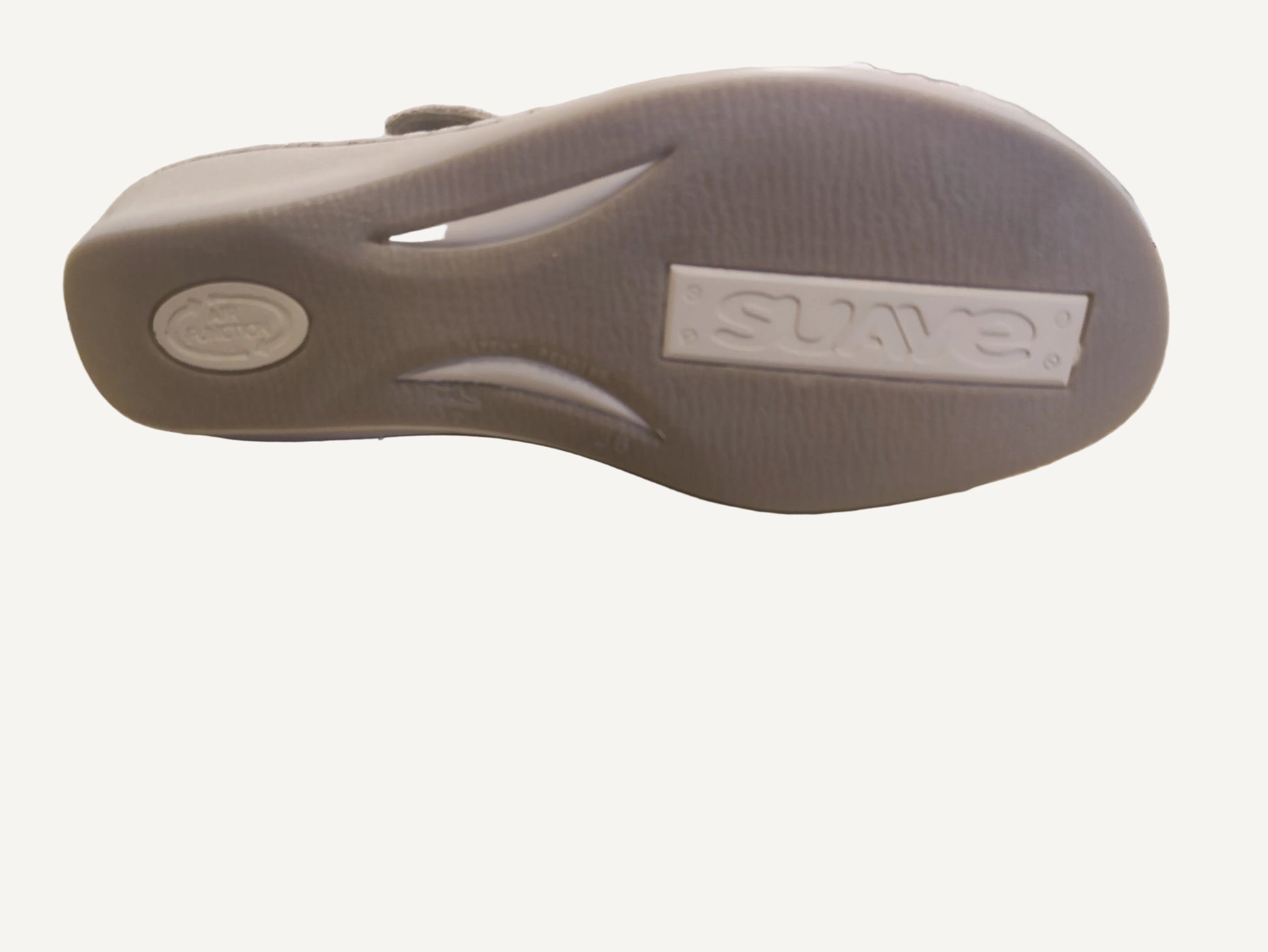 Gray sandal with 'Skechers' branding on a wooden surface
