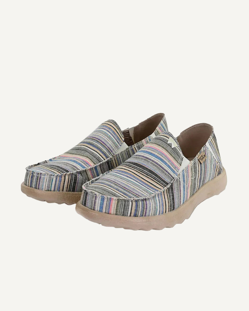 Pair of striped slip-on shoes on a white background