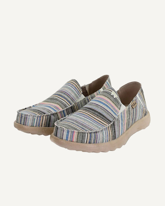 Pair of striped slip-on shoes on a white background