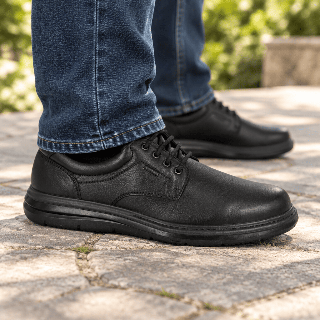 Men's extra-wide waterproof lace-up shoe, black leather, close-up side with laces and sole