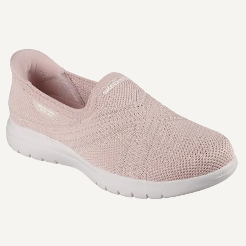 Pink slip-on shoe with white sole on a white background