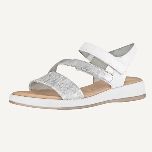 White sandal with a single strap on a white background