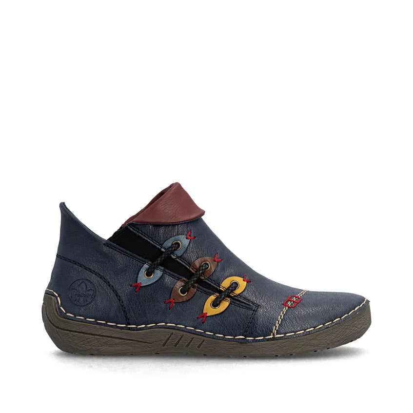 Women’s dark blue ankle boot with brown collar, side stitch detailing, and colorful embroidery