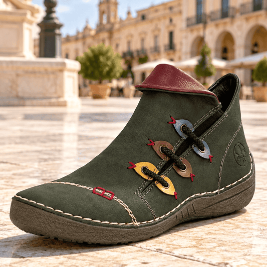 Olive green ankle boot with lace-up front, colorful fish eyelets, and red collar