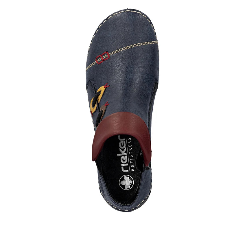 Women’s dark blue boot profile with brown heel lining, stitched seam edges, and colorful laces