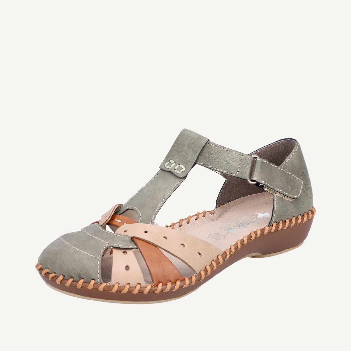Gray sandal with brown accents on a white background