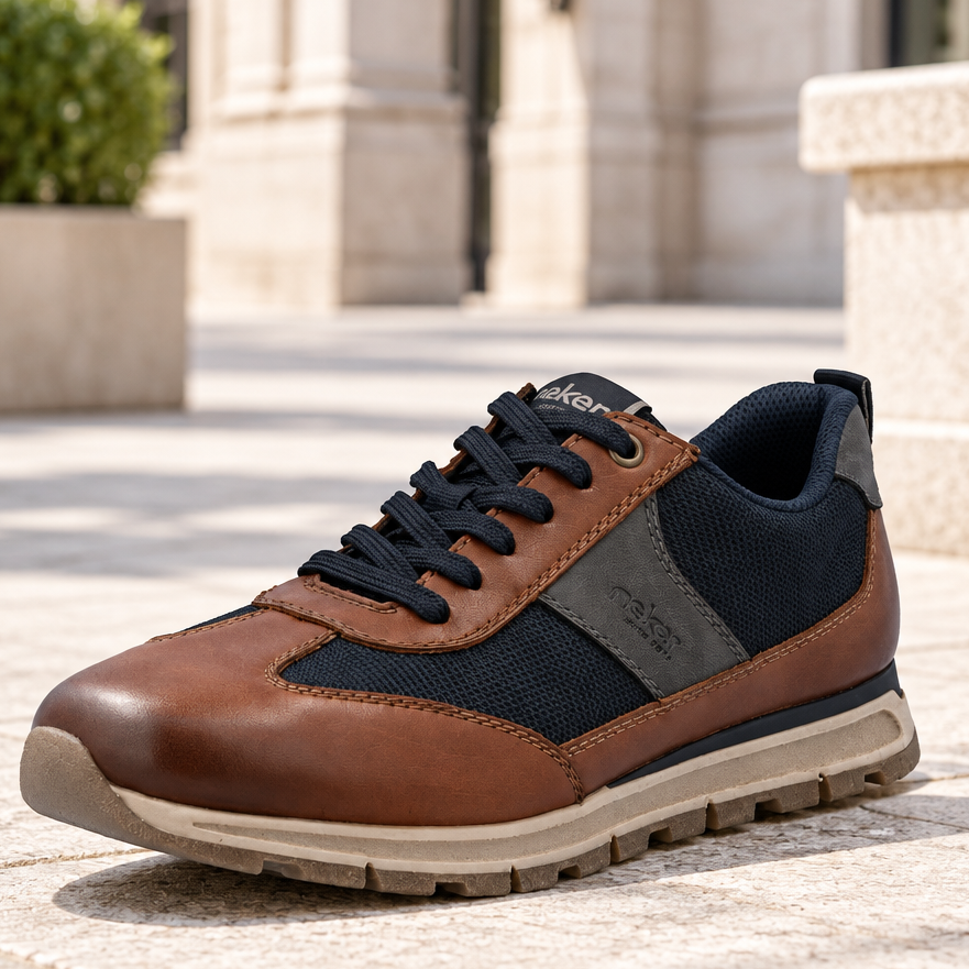 Men's brown leather lace-up trainer with navy mesh side panels and chunky tread sole
