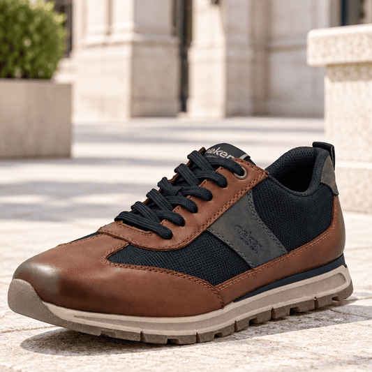 Men's brown leather lace-up trainer with navy mesh side panels and chunky tread sole